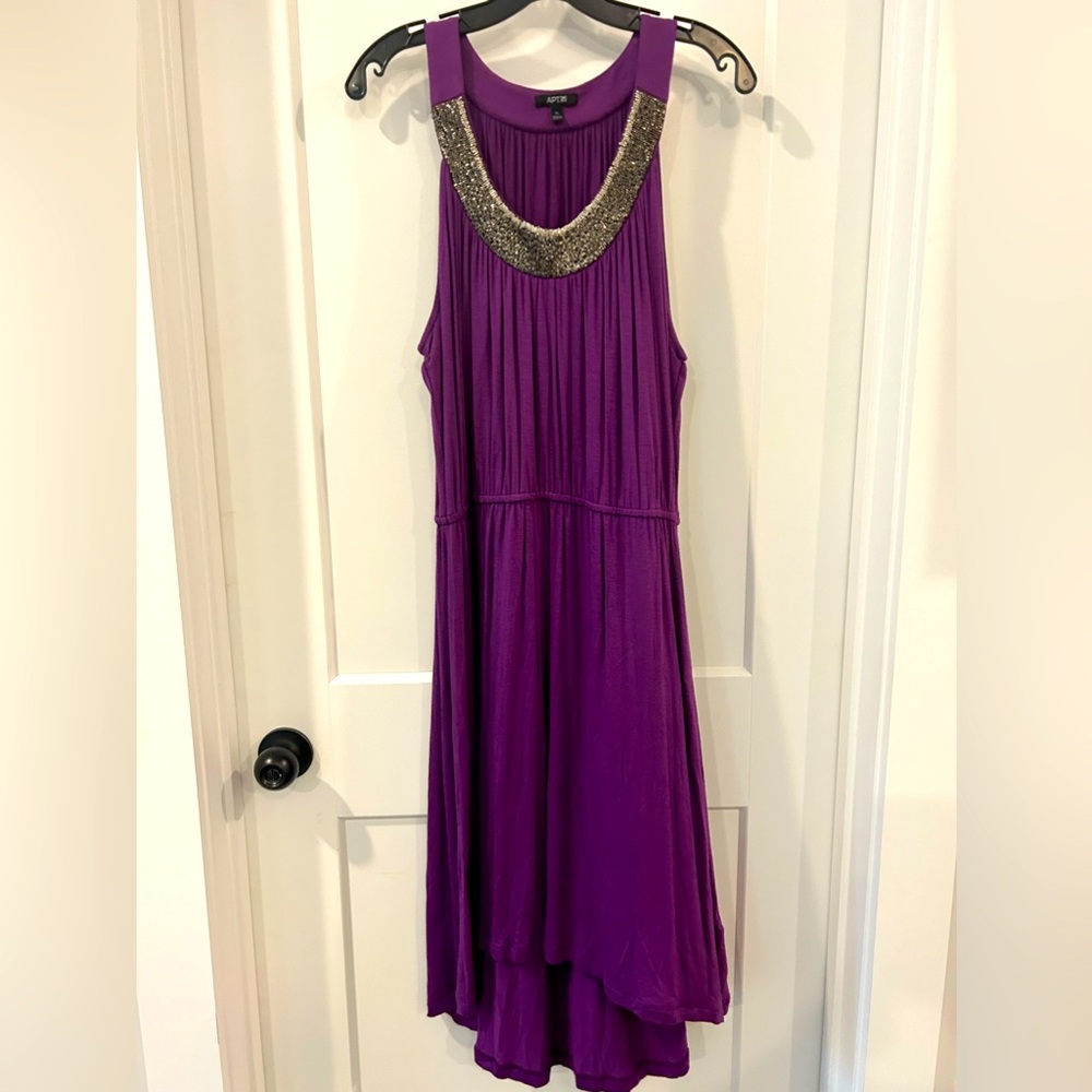 Purple cotton dress with beaded neckline and high low skirt.